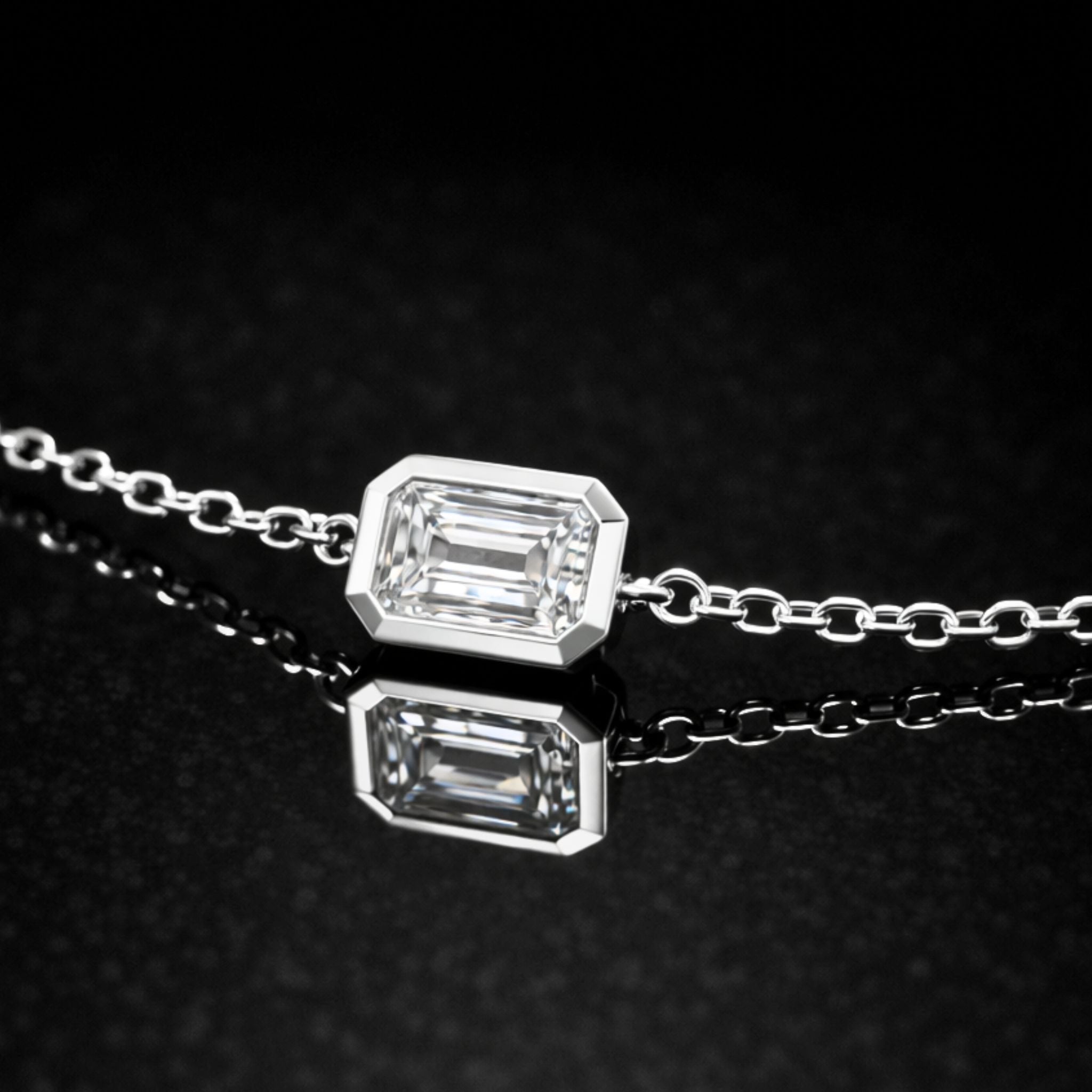 18K solid gold emerald-cut lab-grown diamond bezel bracelet on black mirror background