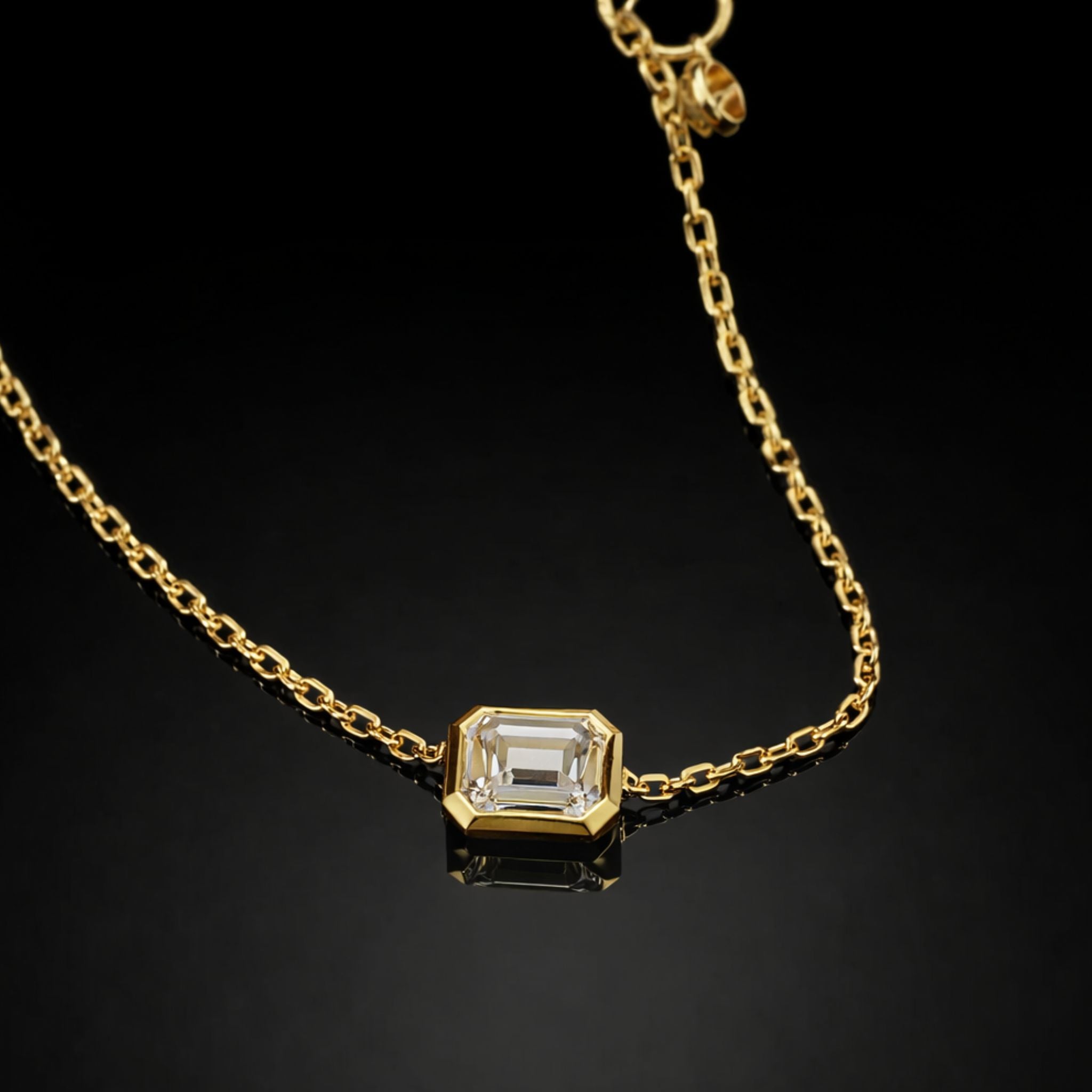 18K solid gold emerald-cut lab-grown diamond bezel bracelet on black mirror background
